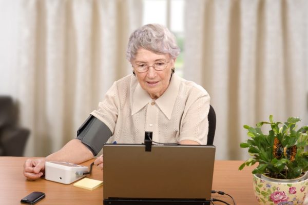 Older lady measuring blood pressure